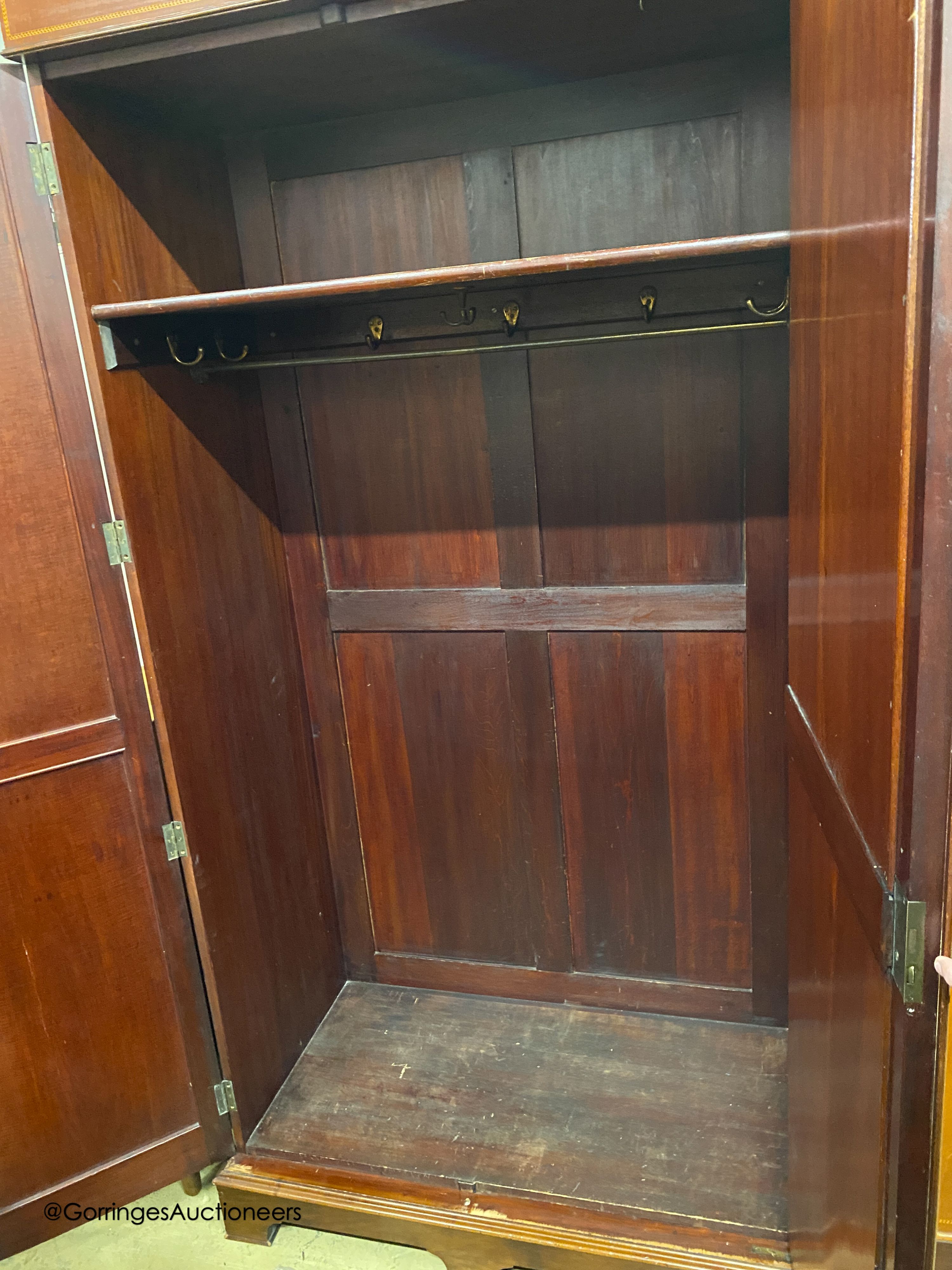 An Edwardian marquetry inlaid mahogany wardrobe, length 154cm, depth 58cm, height 230cm